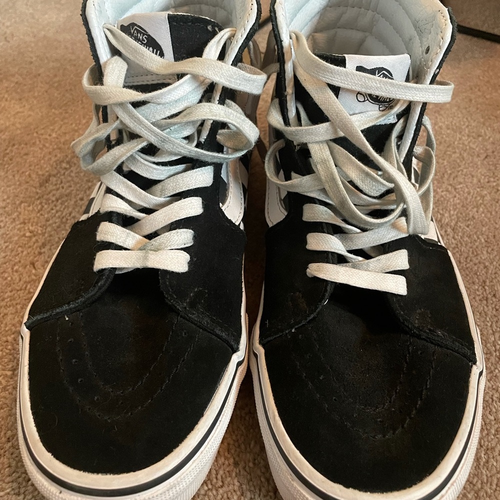 Black checkered high top vans